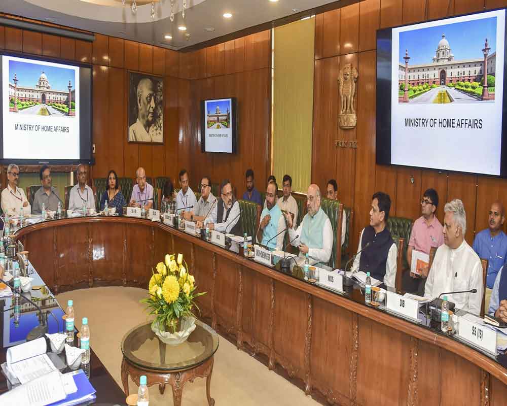 Union Home Minister Amit Shah addresses a meeting of senior officials of his Ministry, at North Block in New Delhi, Saturday, June 1, 2019. Also seen are MoS in the Ministry of Home Affairs G Kishan Reddy (L) and Nityanand Rai. PTI