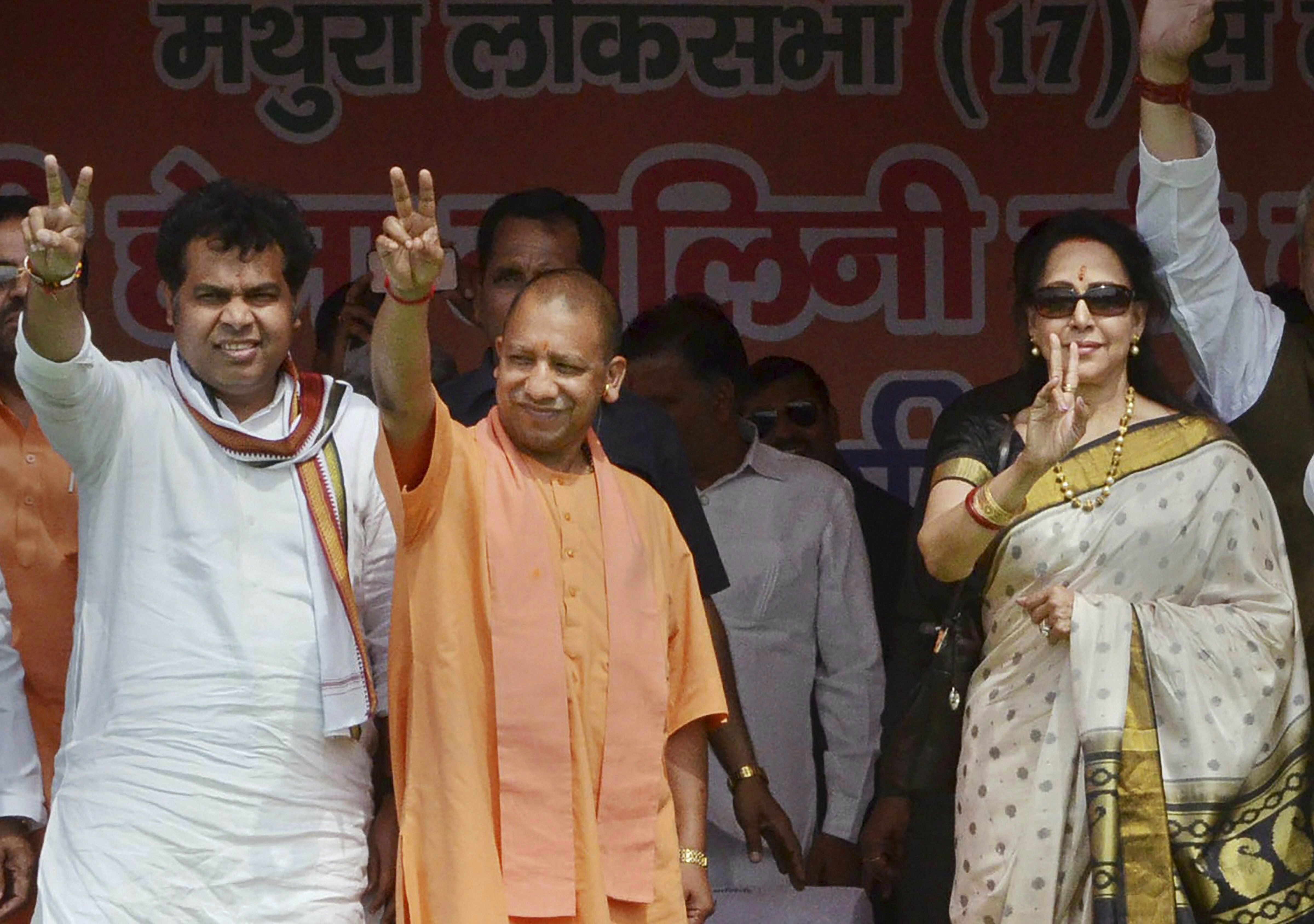 Uttar Pradesh Chief Minister Yogi Adityanath during an election campaign for Bharatiya Janata Party candidate and sitting MP Hema Malini, for the upcoming Lok Sabha polls, in Mathura - PTI