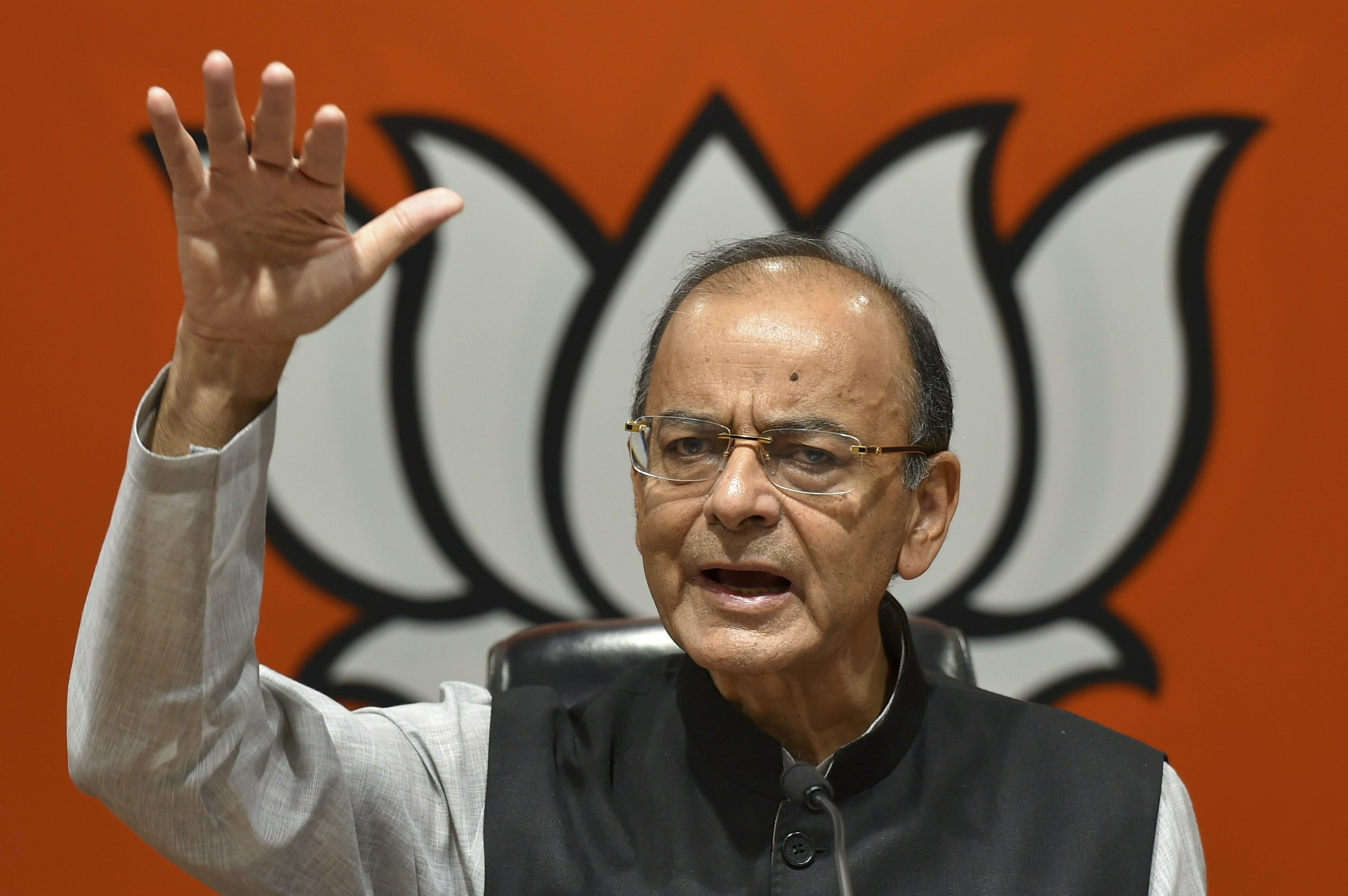 Union Minister of Finance Arun Jaitley gestures as he addresses a press conference at the party headquarters in New Delhi - PTI