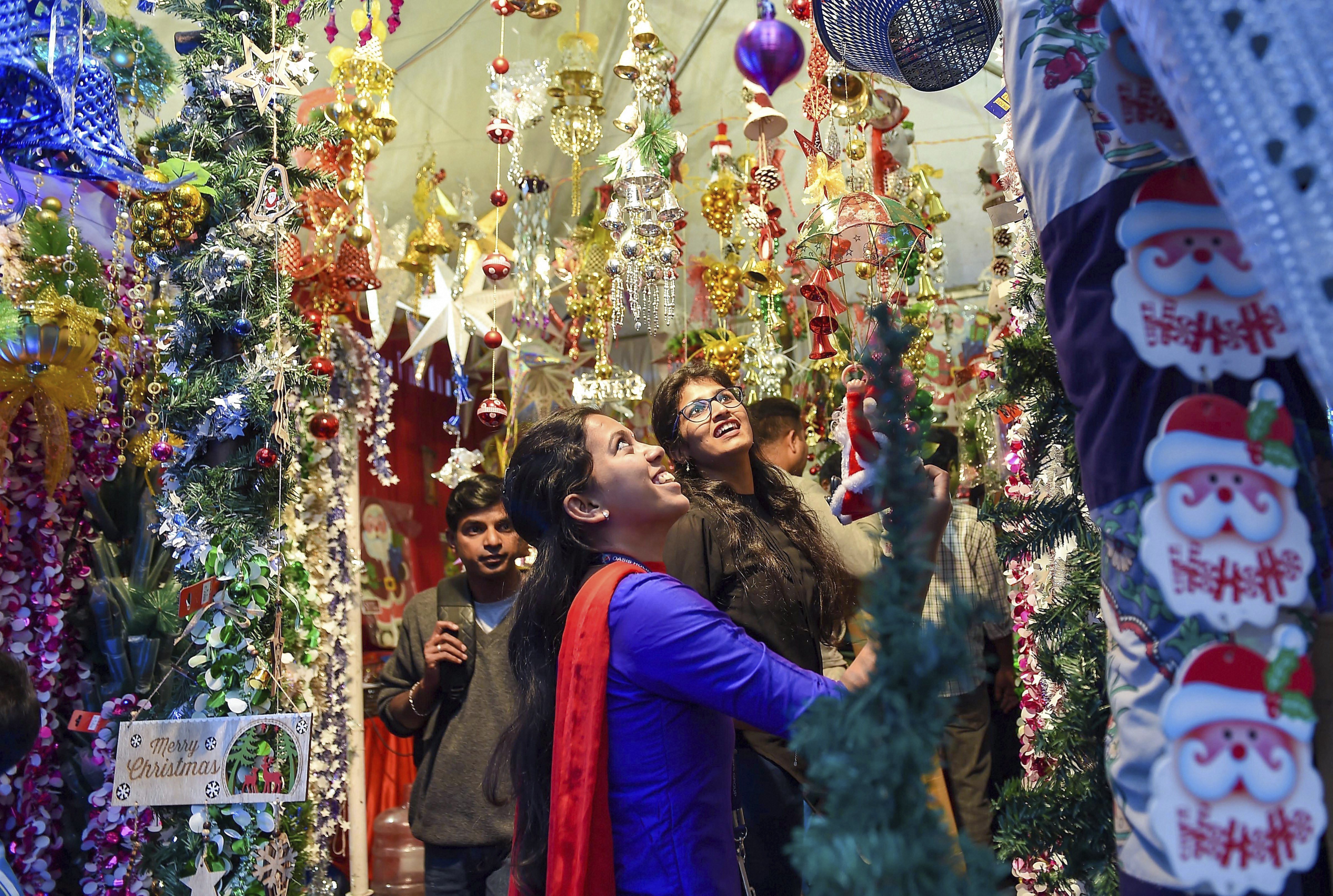 People buy decoration items ahead of Christmas celebrations, in Bengaluru - PTI