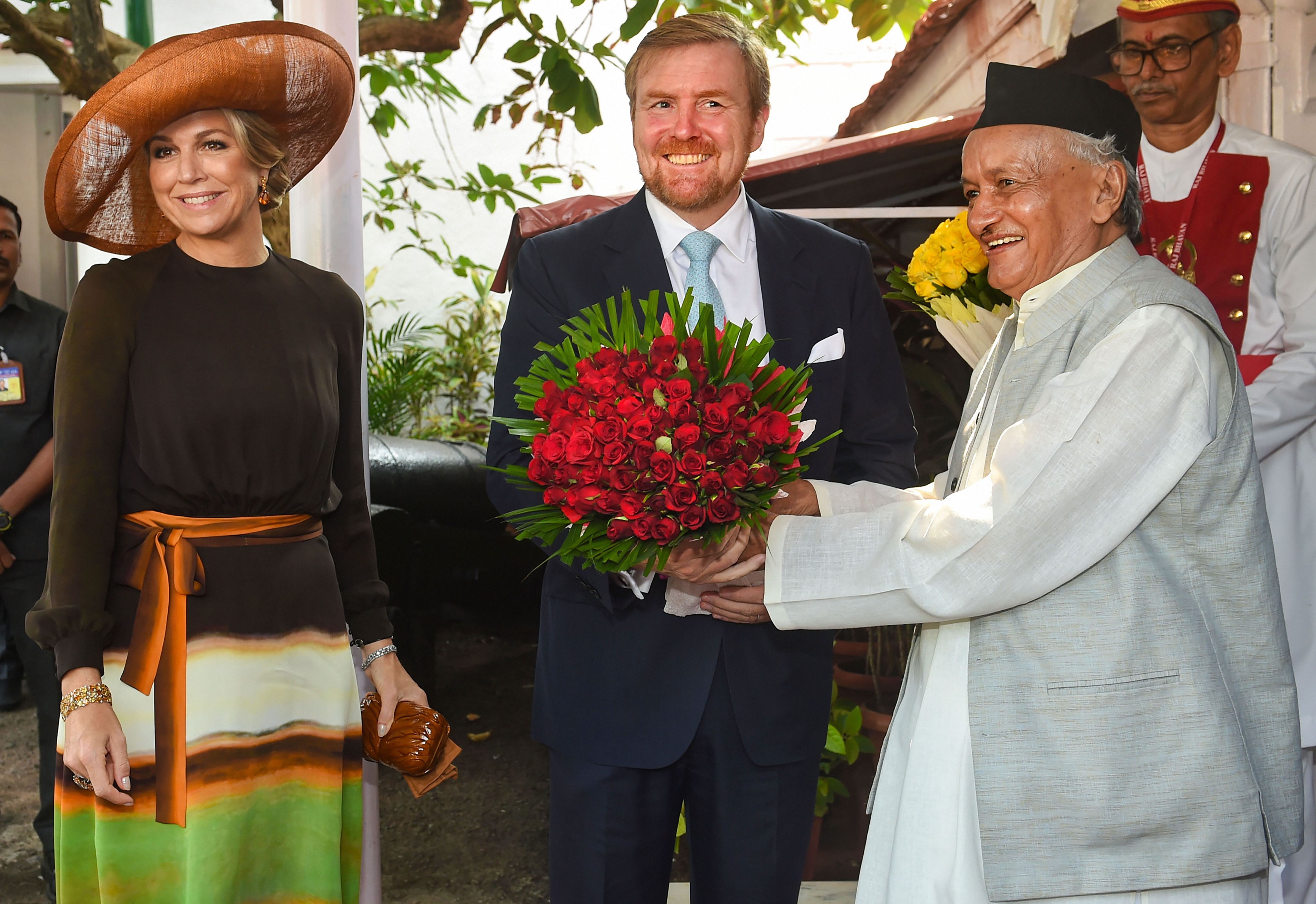 Maharashtra Governor Bhagat Singh Koshyari presents a bouquet to Netherlands King Willem-Alexander as Queen Máxima looks on at Raj Bhavan in Mumbai - PTI