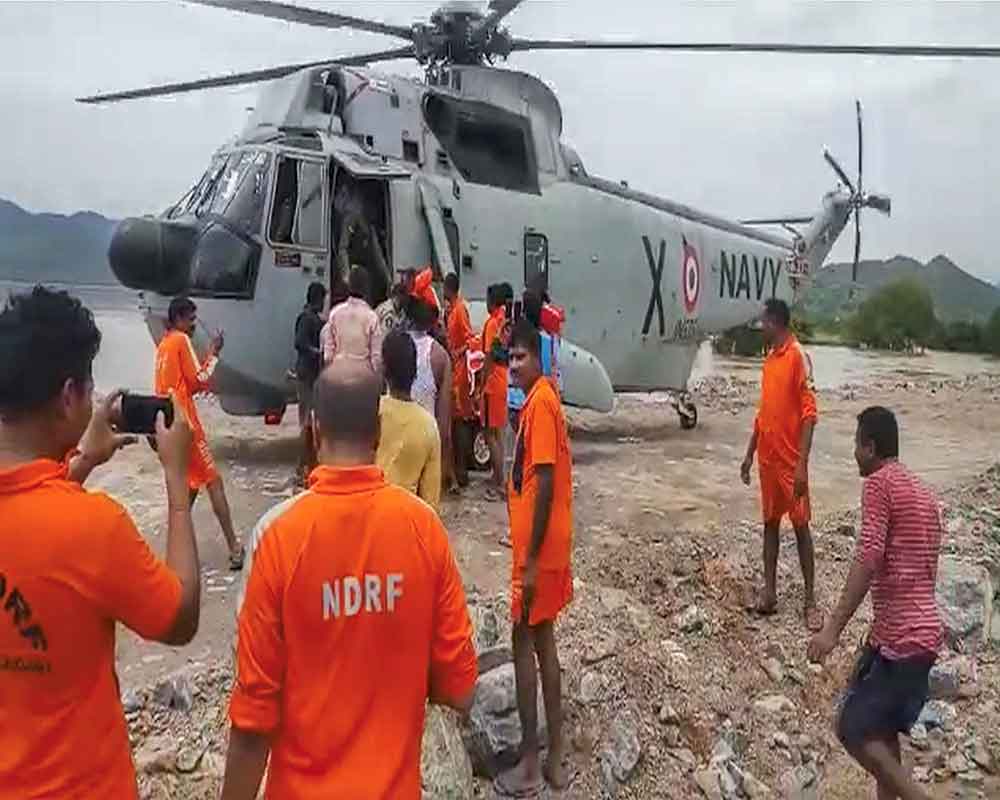 East Godavari: NDRF and navy personnel carry out a rescue operation after a tourist boat capsized in the swollen Godavari river in East Godavari district of Andhra Pradesh - PTI