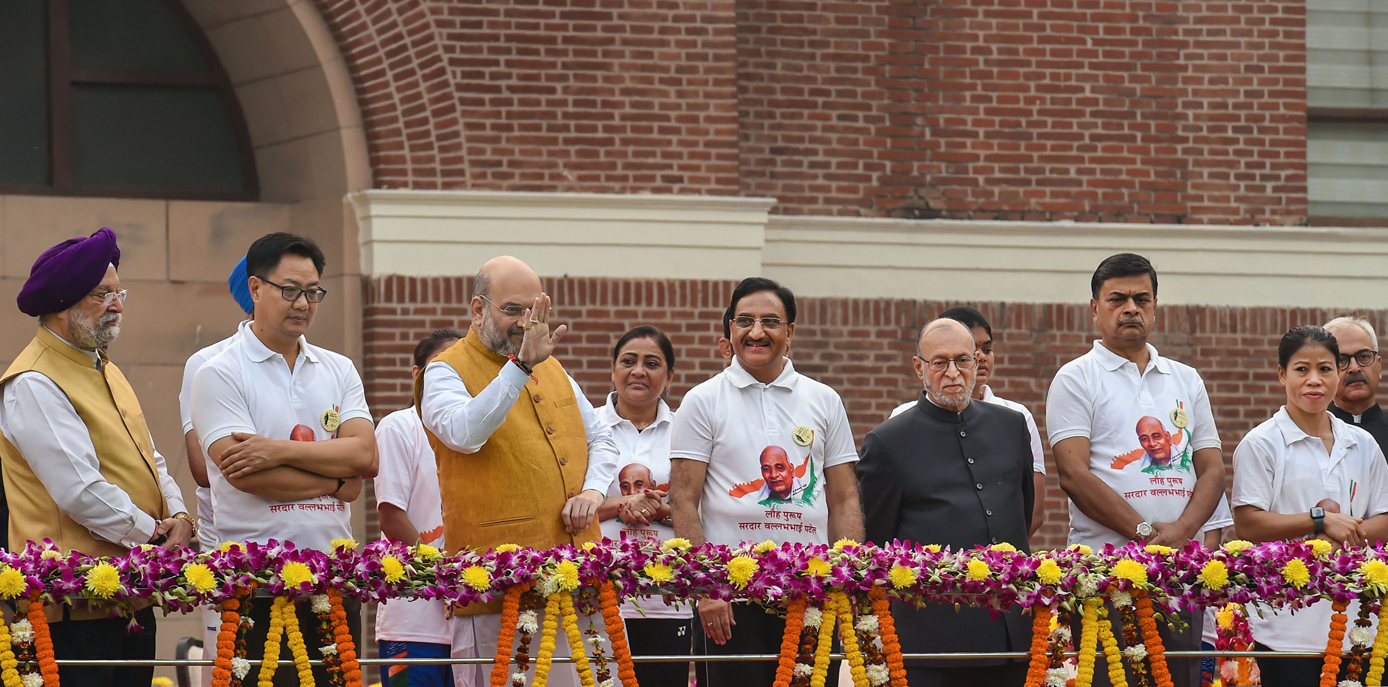Union Home Minister Amit Shah waves as he flags off the 'Run For Unity' from Delhi's National Stadium on the occasion of 144th birth anniversary of Sardar Vallabhbhai Patel - PTI