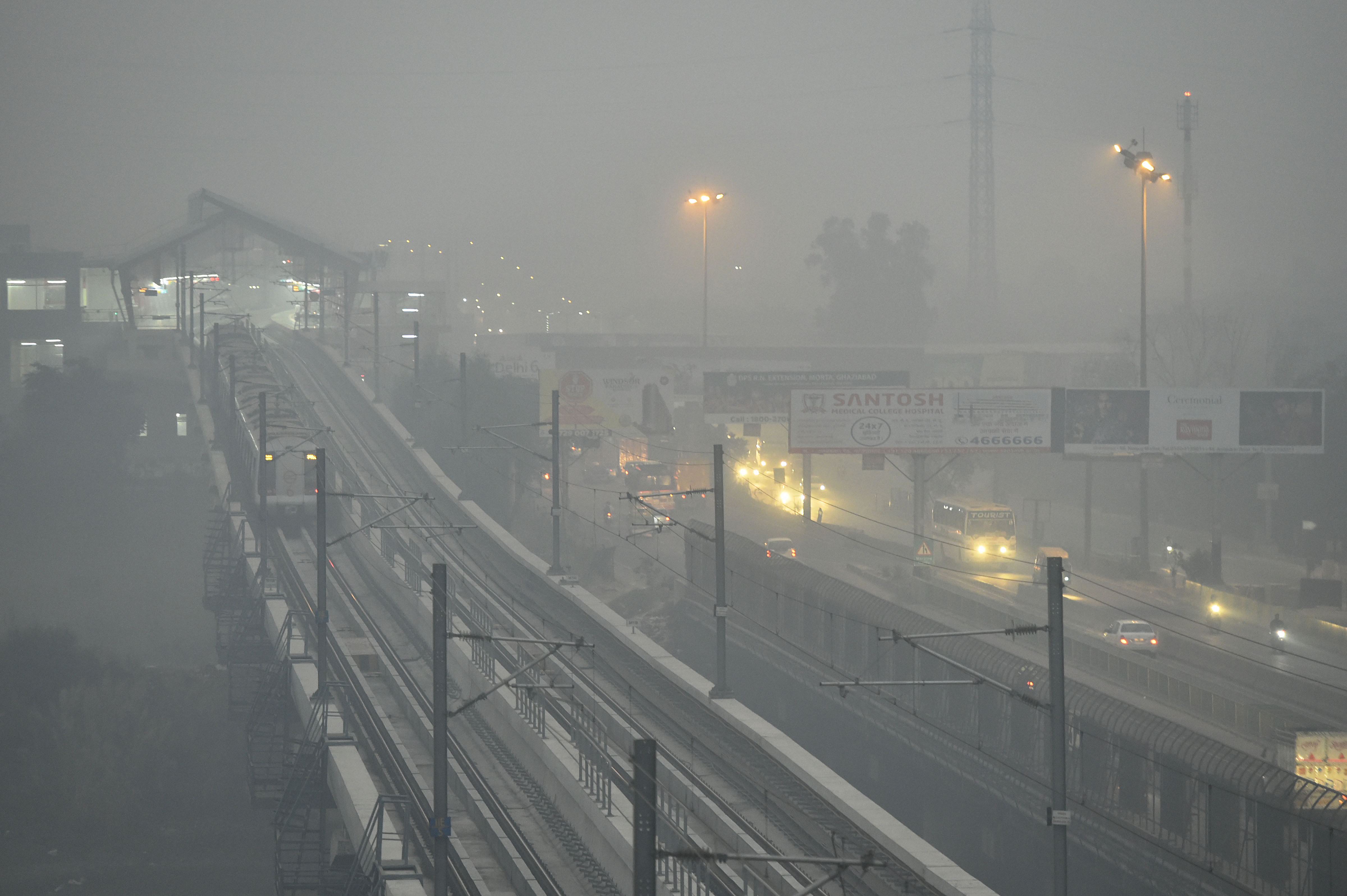 Delhi metro running amid dense haze and low visibility - PTI