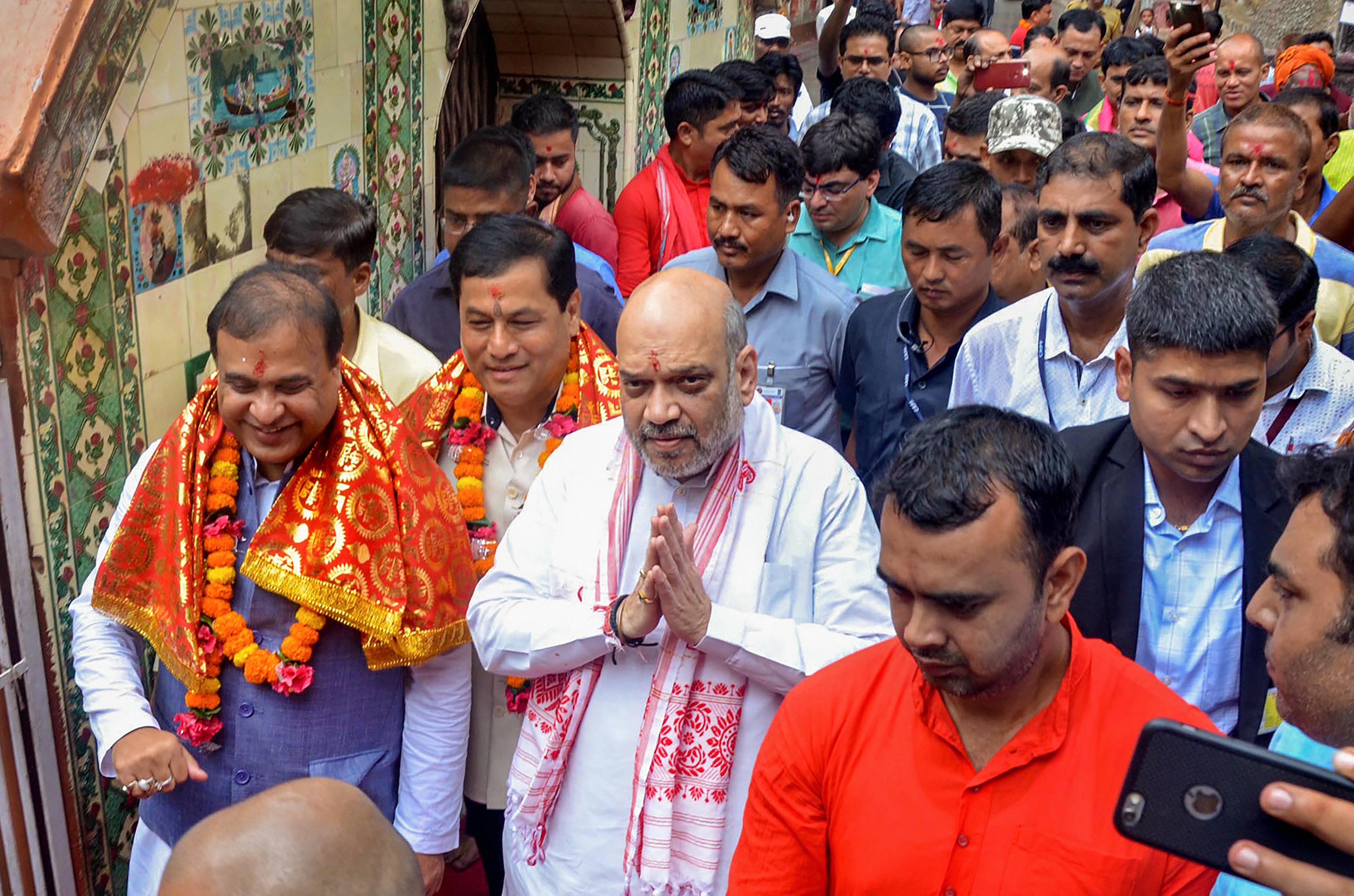 Union Home Minister Amit Shah with Assam CM Sarbananda Sonowal and State Finance Minister Himanta Biswa Sarma comes out after offering payers at Kamakhya Temple - PTI