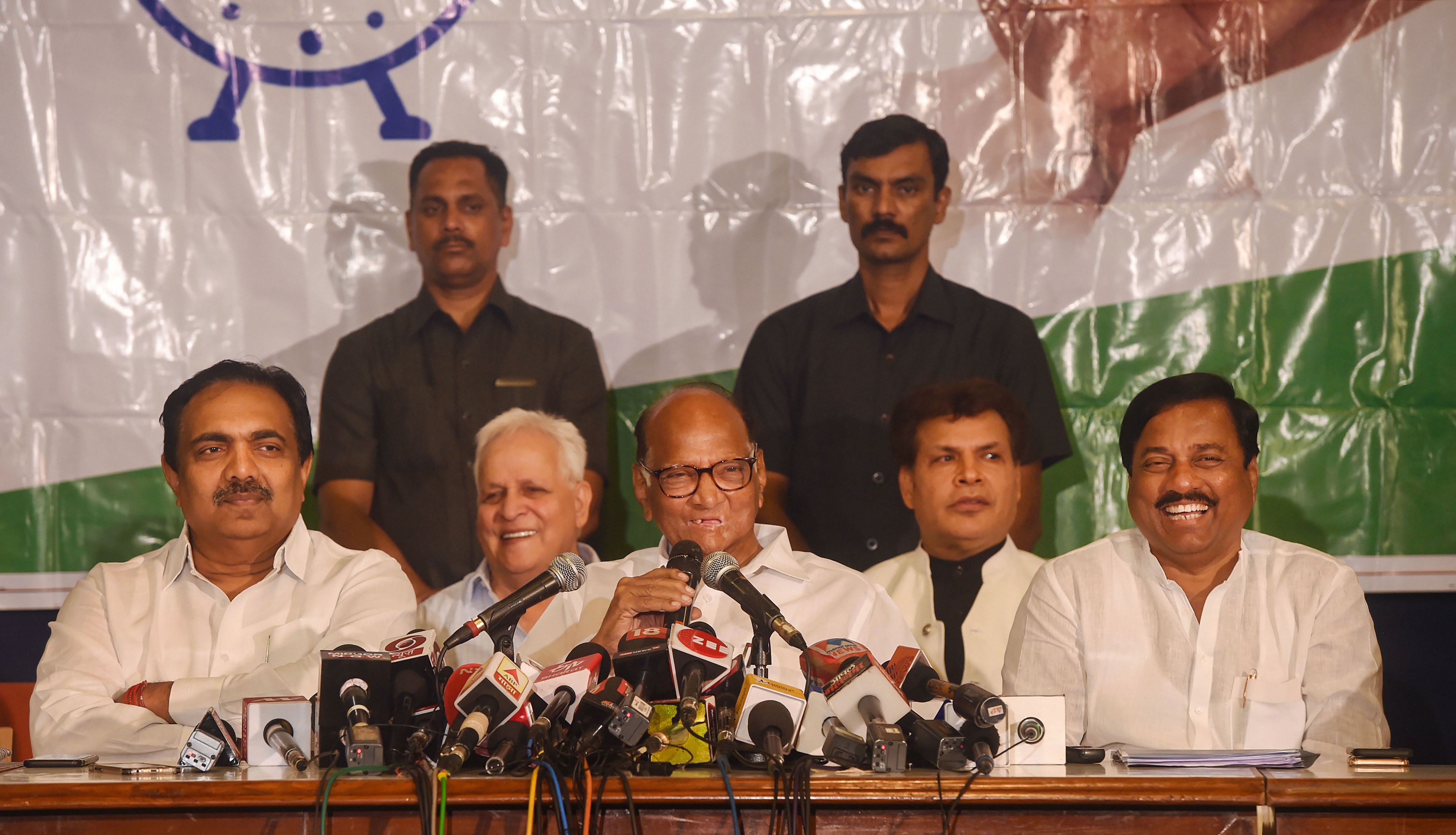 Nationalist Congress Party Chief Sharad Pawar along with party leaders Jayant Patil and Sunil Tatkare addresses a press conference - PTI