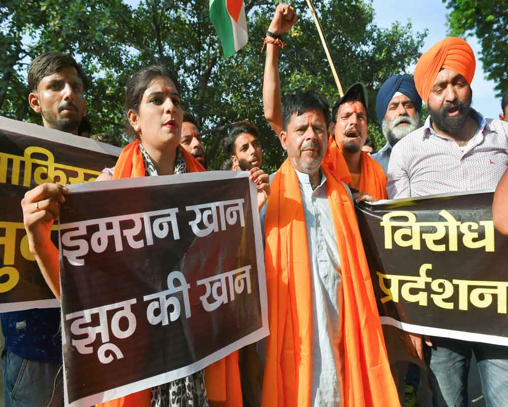 Sikh community members hold placards and raise slogans against the alleged abduction and forcible conversion of Pakistani Sikh girls in Pakistan's Nankana Sahib, in New Delhi - PTI