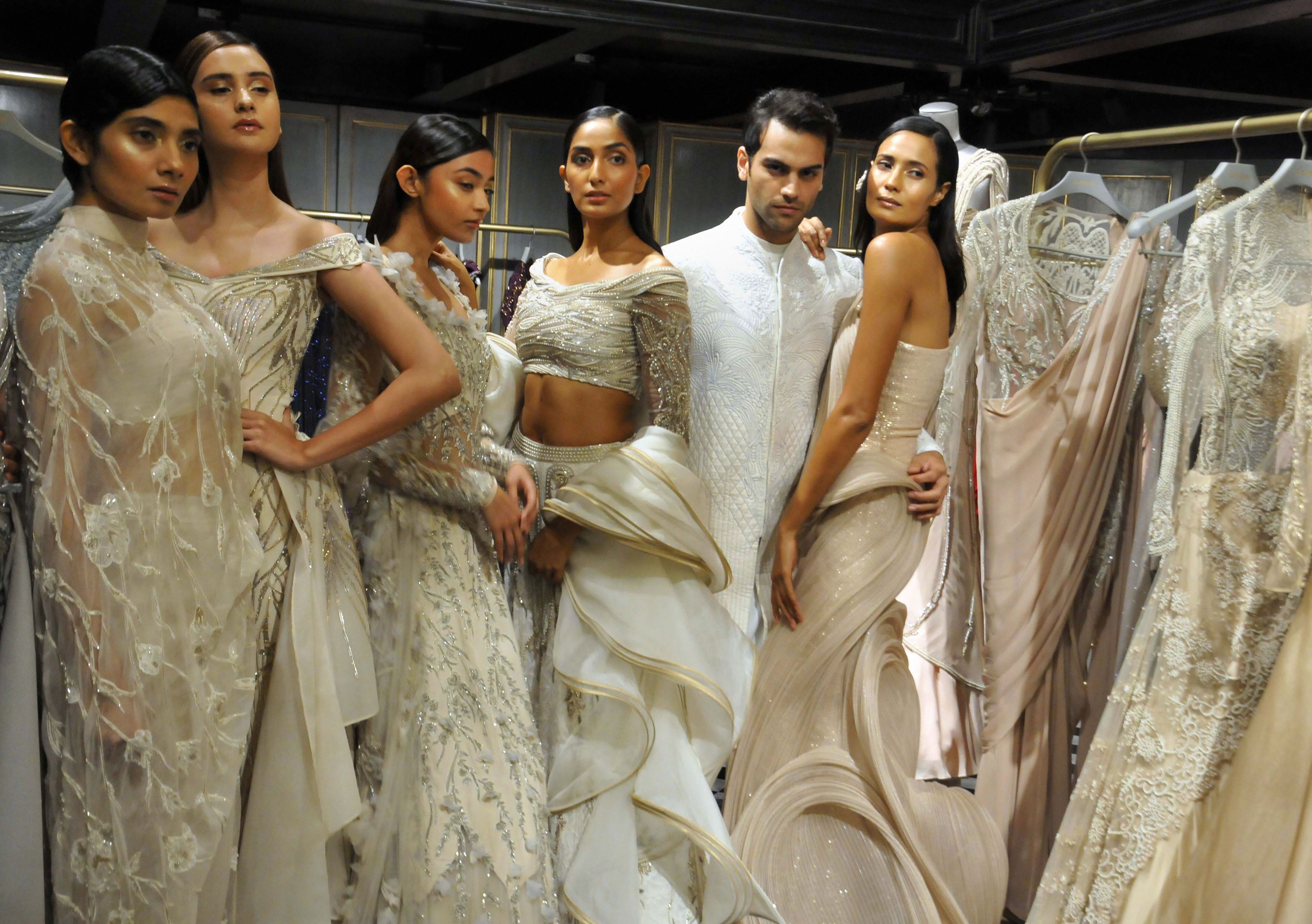 Models showcase the creations by fashion designer Gaurav Gupta during the launch of his flagship outlet - PTI