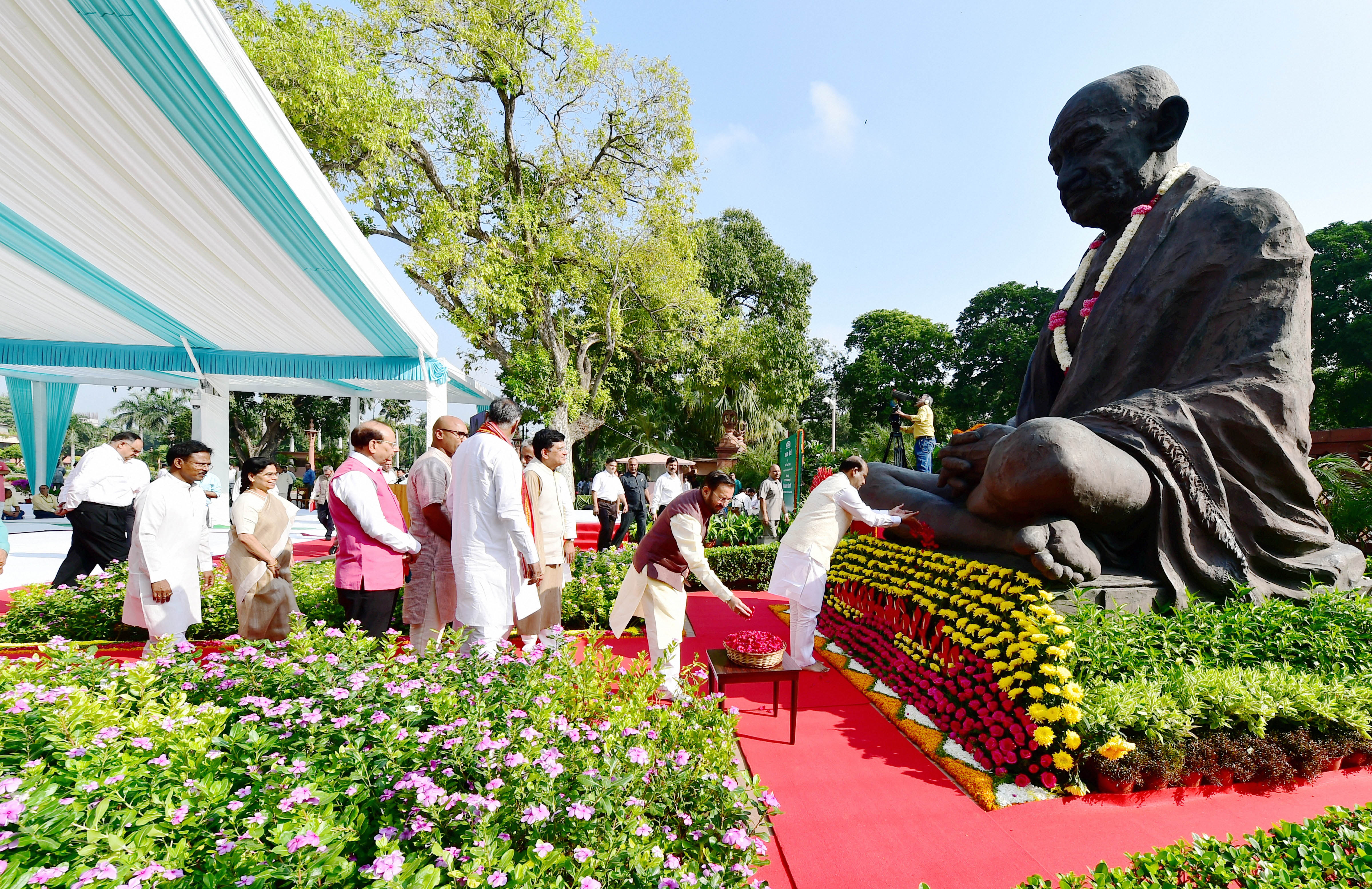 Lok Sabha Speaker Om Birla and other ministers pay tribute to Mahatma Gandhi on his150th birth anniversary at Parliament House - PTI