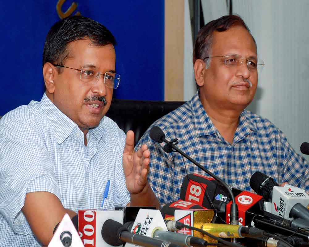 Chief Minister Arvind Kejriwal with Delhi Health Minister Satyendar Jain addresses a press conference - PTI