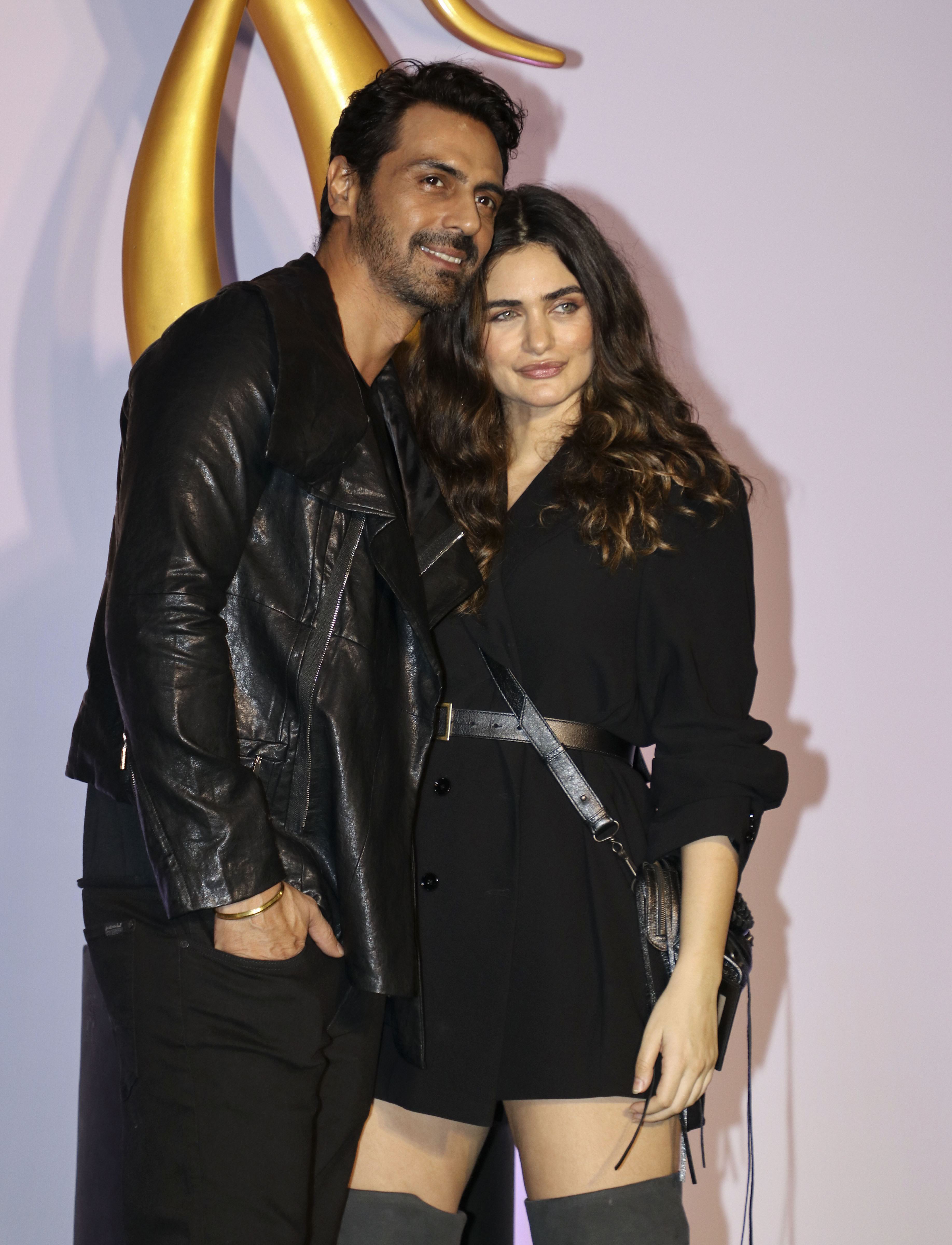 Bollywood actor Arjun Rampal and girlfriend Gabriella Demetriades arrive for the IIFA Rocks of the 20th IIFA Awards - PTI