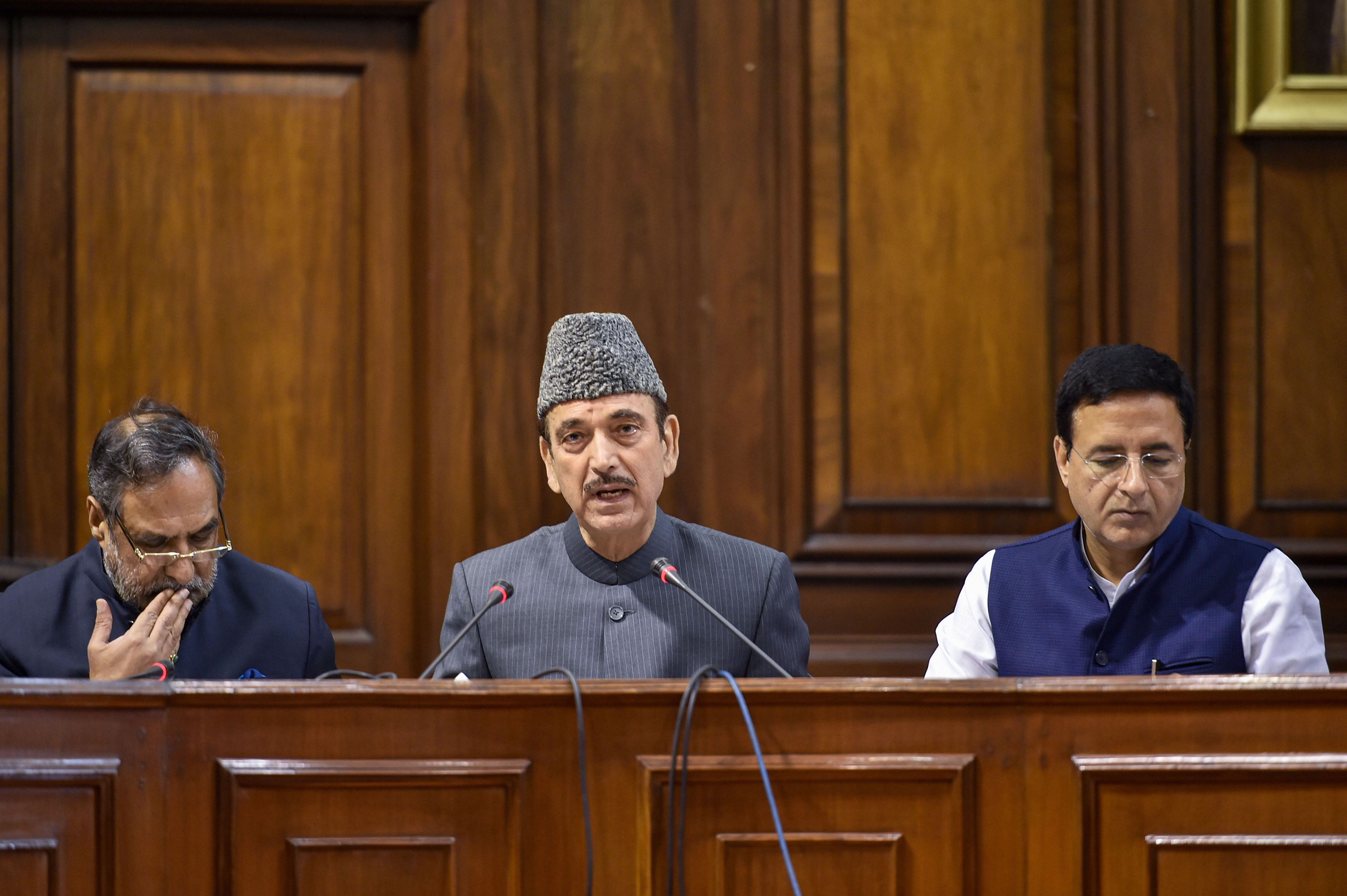 Senior Congress leaders Ghulam Nabi Azad, Anand Sharma and Randeep Surjewala address the media at Parliament House during the ongoing Winter Session - PTI