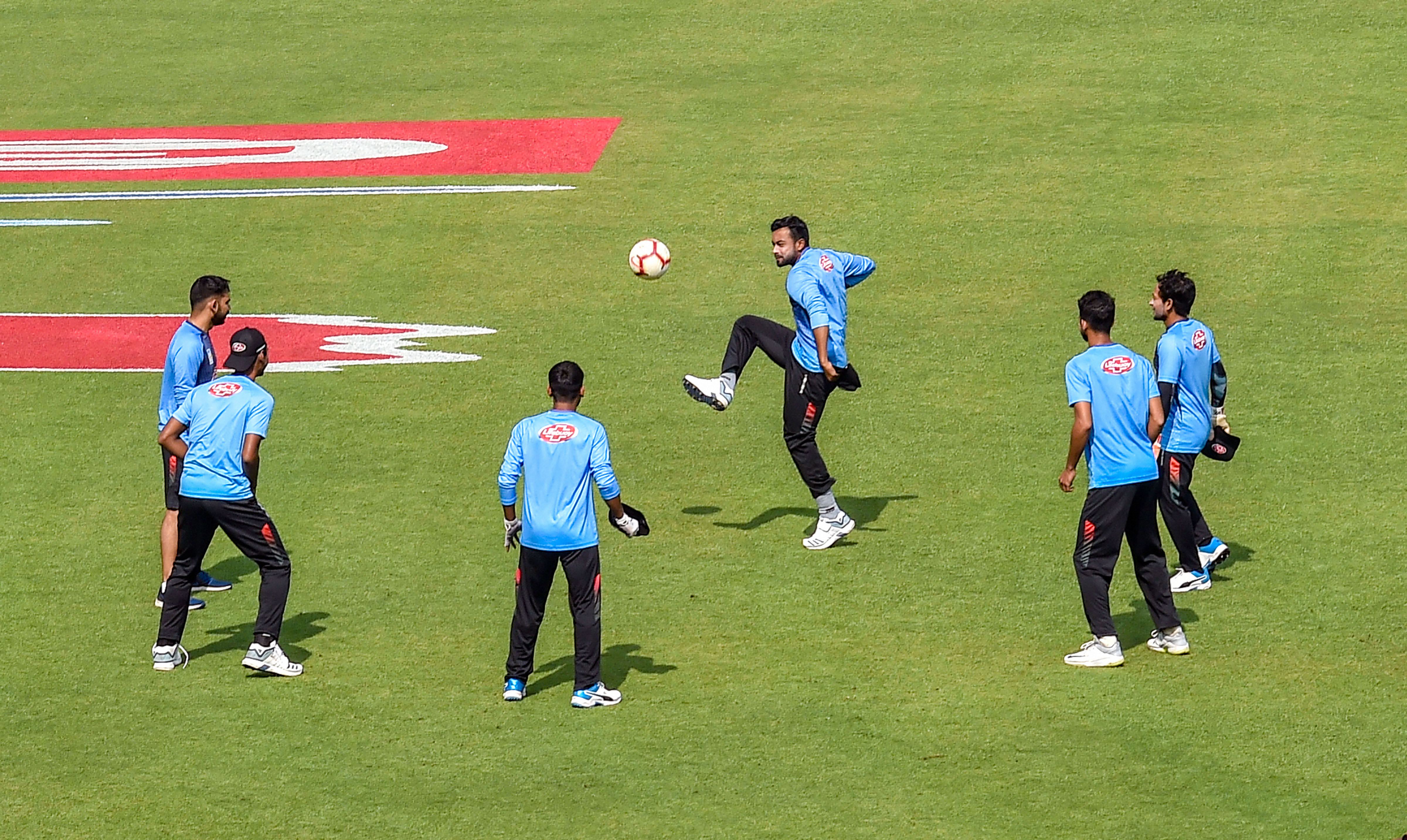 Bangladesh cricketers play soccer during a training session ahead of first day-night cricket test match between India and Bangladesh - PTI