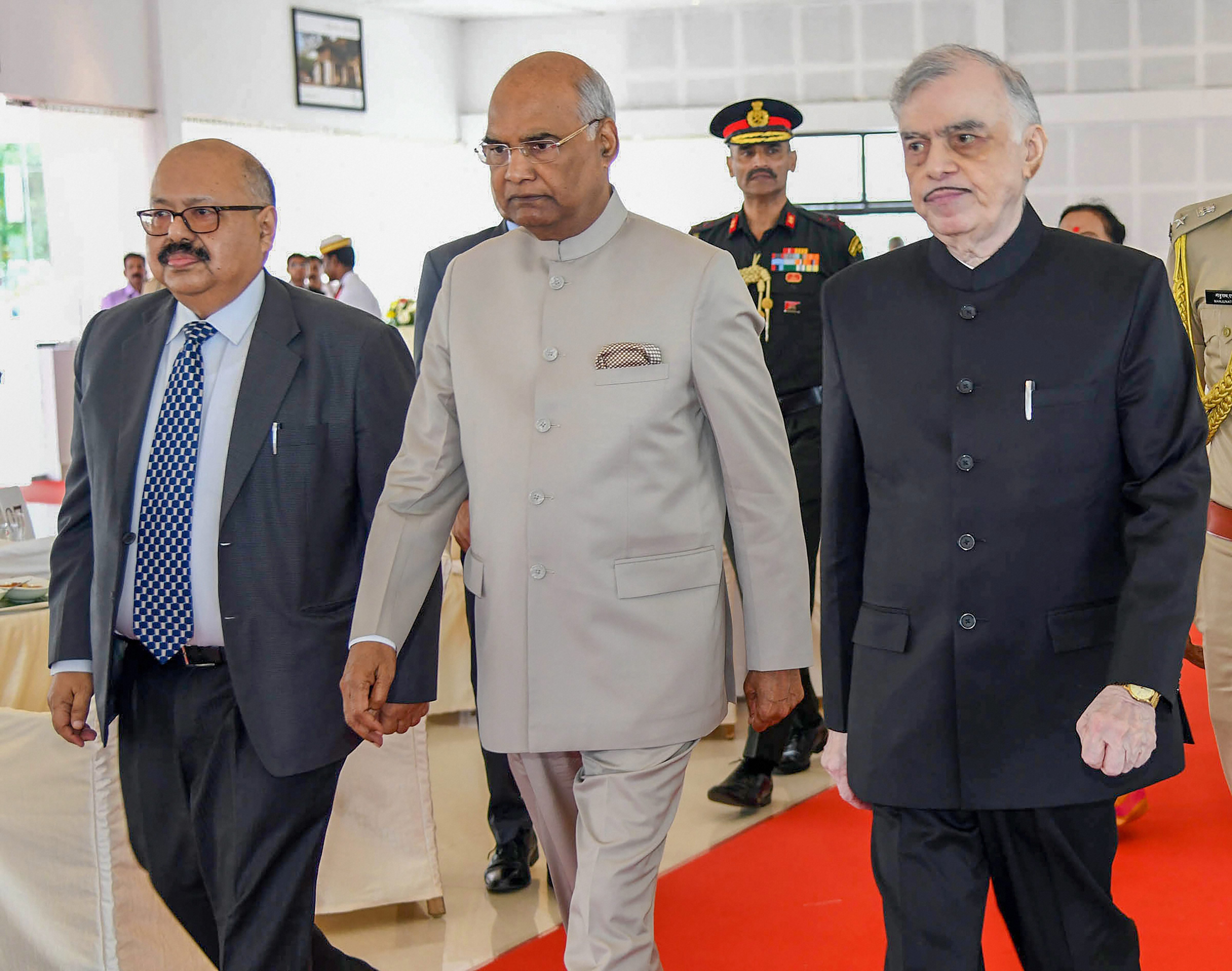 President Ram Nath Kovind (C), Chief Justice of Kerala high court, Rishikesh Roy (L) and Kerala Governor P Sathasivam(R)arrive to attend a meeting at Bolgatty Palace, in Kochi - PTI