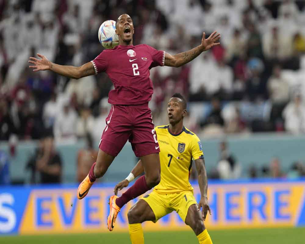 Qatar's Pedro Miguel, left, challenges for the ball with Ecuador's Pervis Estupinan during the World Cup group A soccer match between Qatar and Ecuador at the Al Bayt Stadium in Al Khor, Qatar, Nov. 20, 2022.